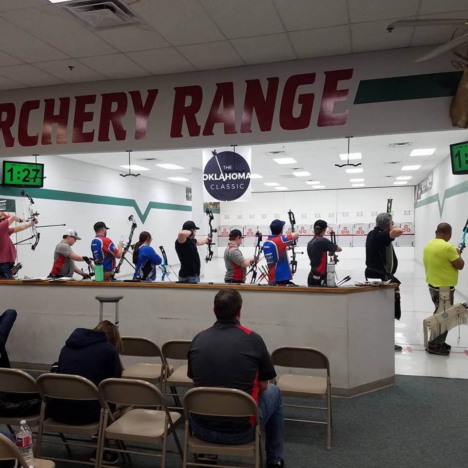 A group of people practicing archery at H&H Shooting Sports in Oklahoma City