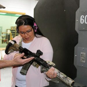 A man and woman observe a gun in Oklahoma City.